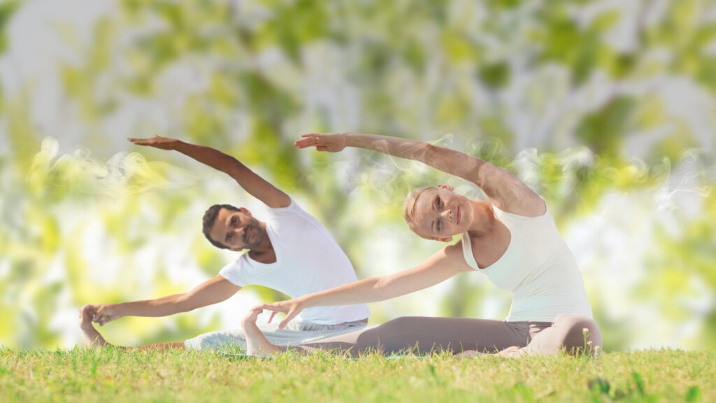 A happy couple practicing yoga together to reduce stress and improve fertility naturally before considering IVF.