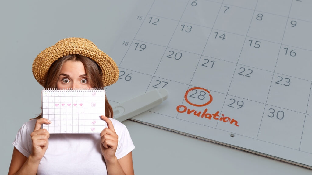 Woman marking ovulation days on a calendar app to track fertile window naturally before IVF.